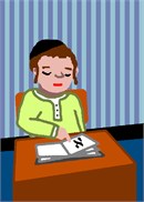 A young Jewish boy sitting at his desk in school points to the place in his workbook.