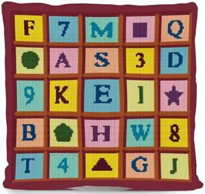 This sim depicts the letters-numbers-shapes piece stitched up as a soft pillow.