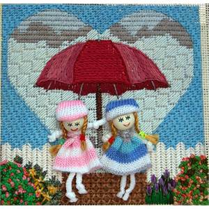 Photograph of stitched  canvas with knit doll embellishments.