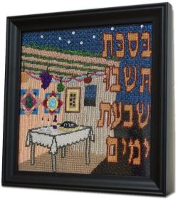 framed needlepoint of sukkah